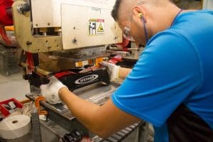 Skilled machinist works the Boardman Molded Products production line